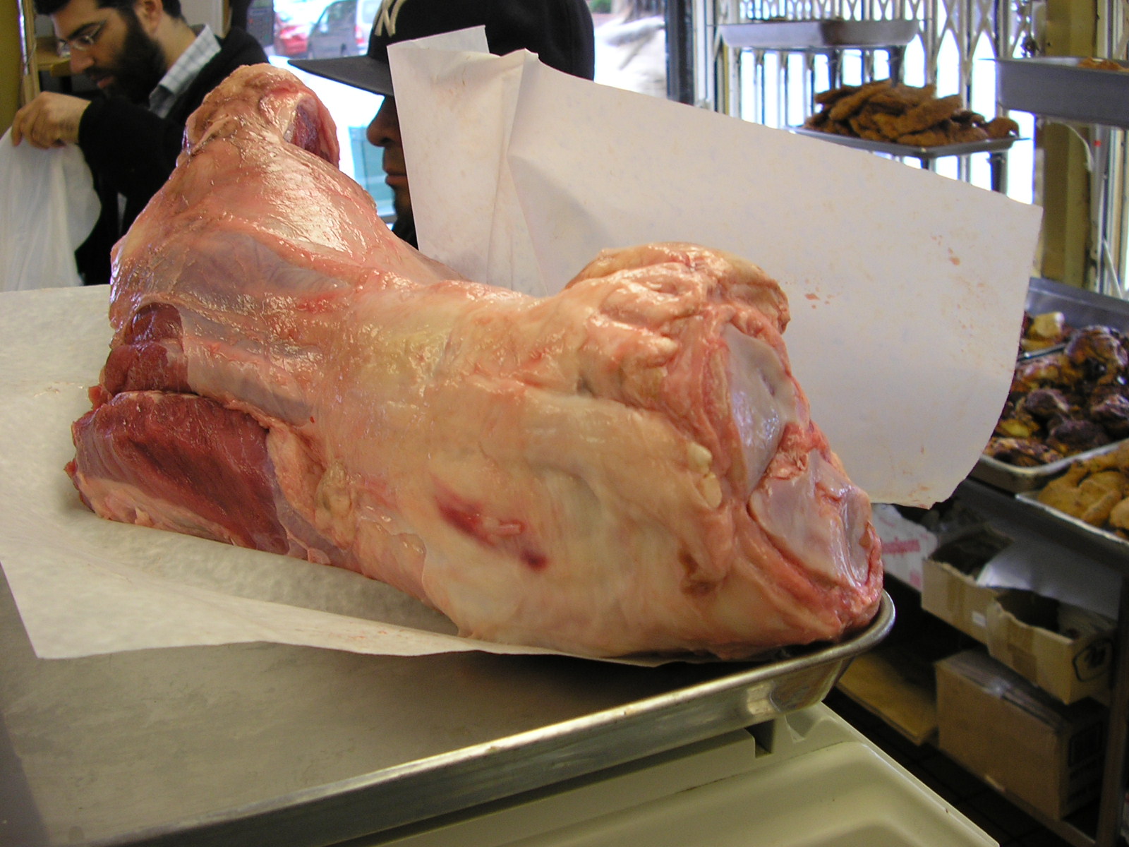 Intact right foreleg shown on a scale before further cutting and preparation